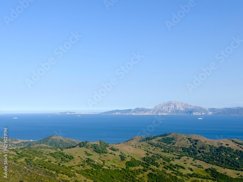 View from the Mirador del Estrecho viewpoint between Tarifa and Algeciras in Andalusia across the Strait of Gibraltar to Morocco with the Jbel Musa mountain and Ceuta, Spain