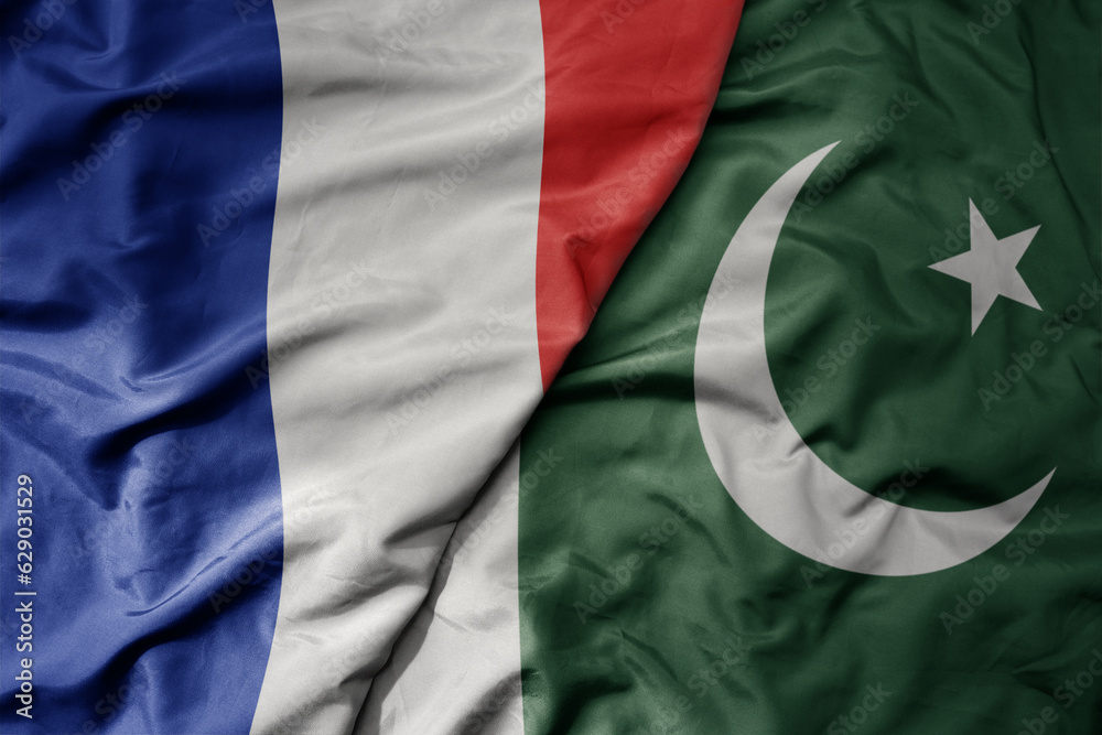 Fototapeta premium big waving realistic national colorful flag of france and national flag of pakistan .