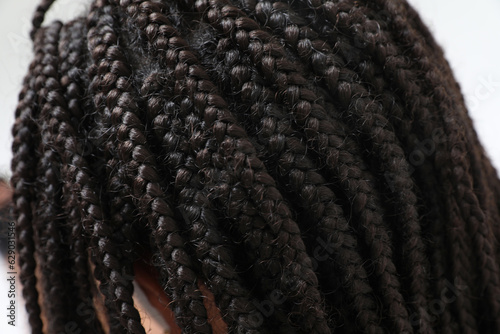 African female beauty with braided hair. Close-up portrait.