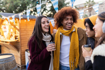 Multiracial young happy group of friends having fun together on winter holidays