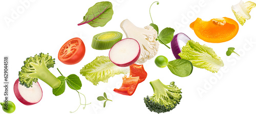 Fototapeta Naklejka Na Ścianę i Meble -  Falling vegetables, salad of bell pepper, tomato and lettuce leaves
