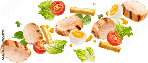 Fototapeta Naklejka Na Ścianę i Meble -  Falling chicken Caesar salad ingredients isolated