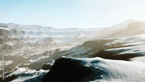 Rocks covered in snow in ski resort photo