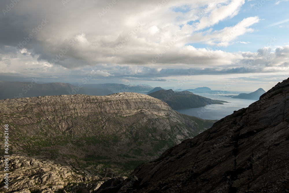 View south from Smaltinden of Brensla, Stockatinden, Hammaröyfjellet and syv søstre in the background. Afternoon hiking in Northern Norway, summer. Fjelltur i Helgeland. Archipelago Norwegian sea. 