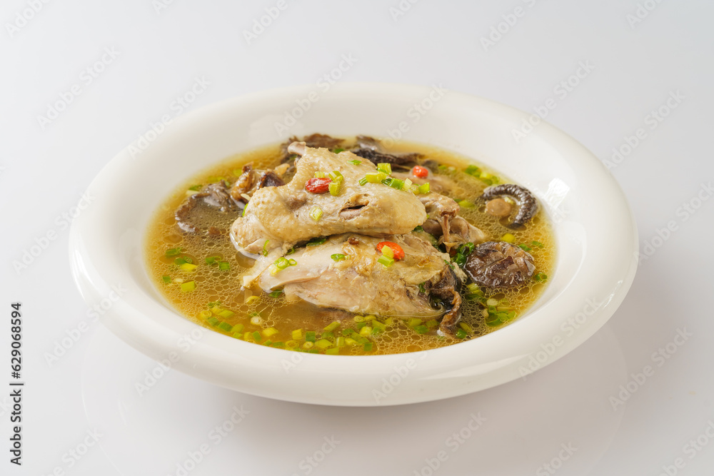 Special Chinese food stewed chicken with mushrooms on retro dark background Special Chinese food stewed chicken with mushrooms on retro dark background