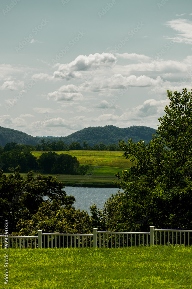 landscape with a white fence and sky landscape with a white fence and sky