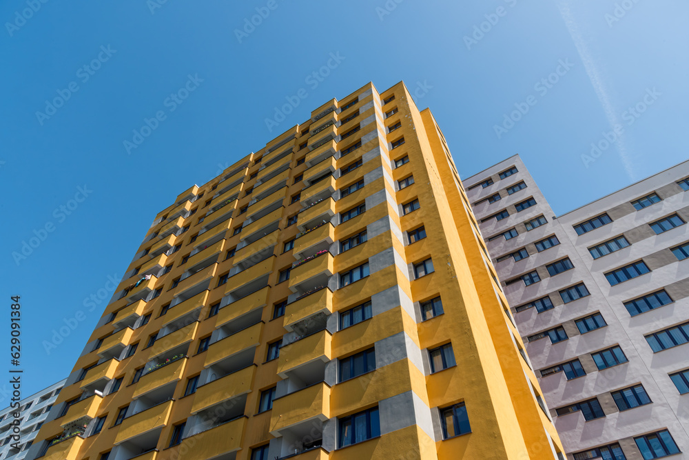 Yellow multistory apartment house in the city of Berlin Yellow multistory apartment house in the city of Berlin