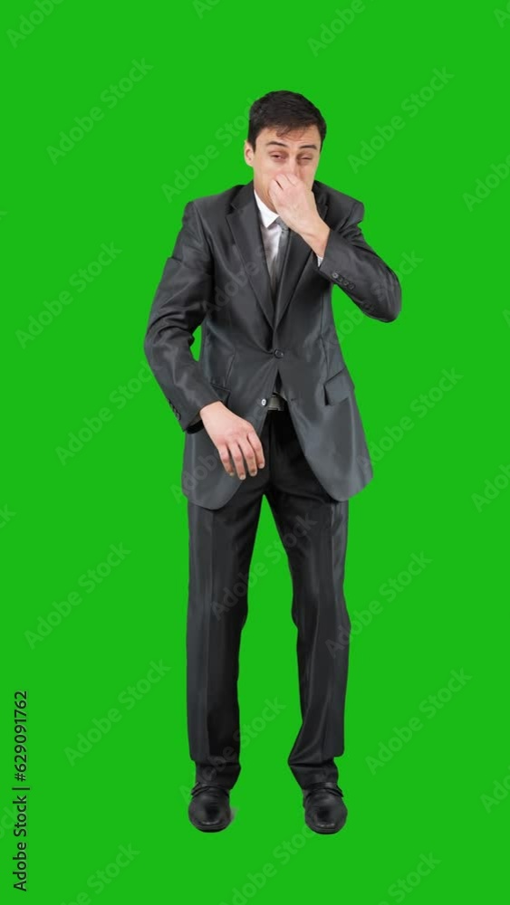 Businessman feeling bad smell in studio. Chroma key Businessman feeling bad smell in studio. Chroma key