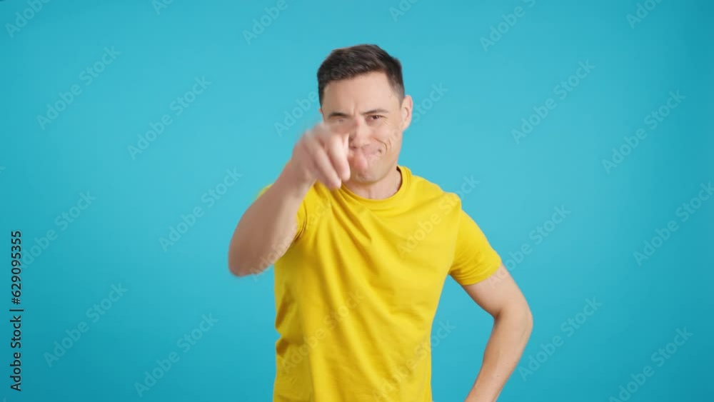Smiling man pointing to front demanding responsibility Smiling man pointing to front demanding responsibility