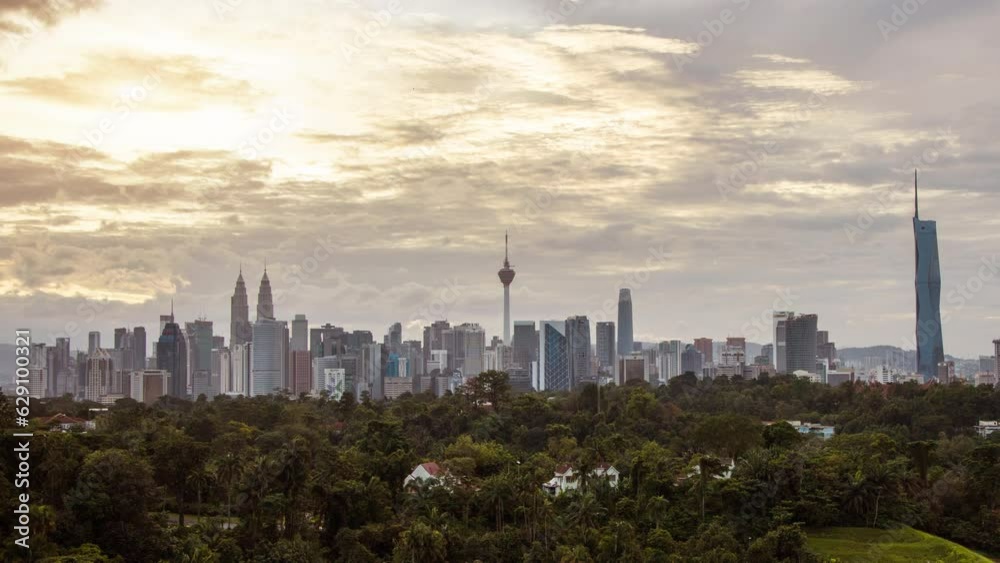 aerial view of Kuala Lumpur city, skyline in Federal Territory, MalaysiaKuala Lumpur Time Lapse, Traffic light trails and pedestrians near The Petronas Towers. aerial view of Kuala Lumpur city, skyline in Federal Territory, MalaysiaKuala Lumpur Time Lapse, Traffic light trails and pedestrians near The Petronas Towers.