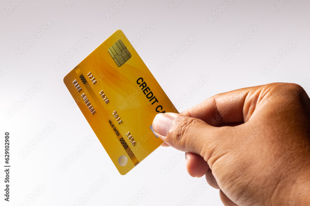 Hand holding credit card isolated on white background Hand holding credit card isolated on white background