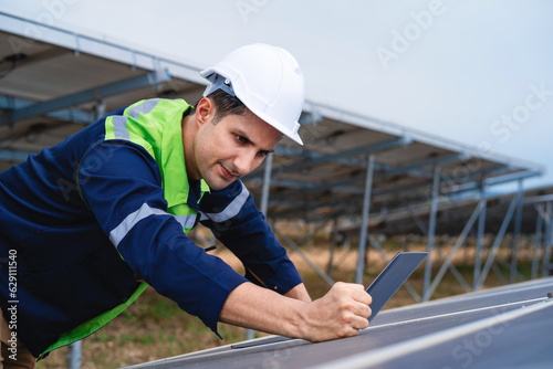 Maintenance engineer Solar system engineer analyzing solar panels. Photovoltaic module concept for clean energy production.