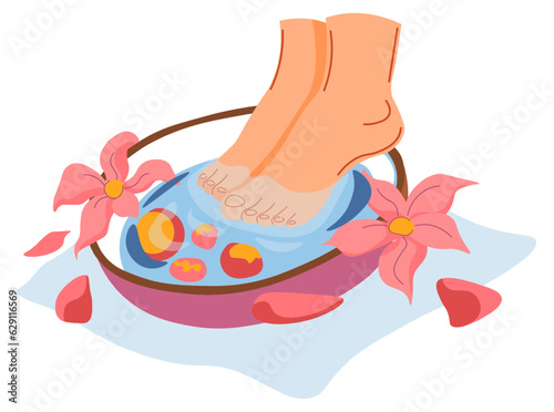 Soaking feet in bowl with aromatic water spa salon