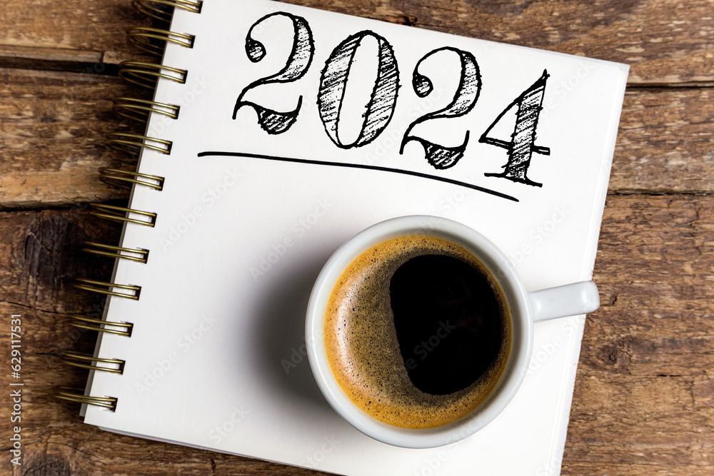 New year resolutions 2024 on desk. 2024 resolutions list with notebook