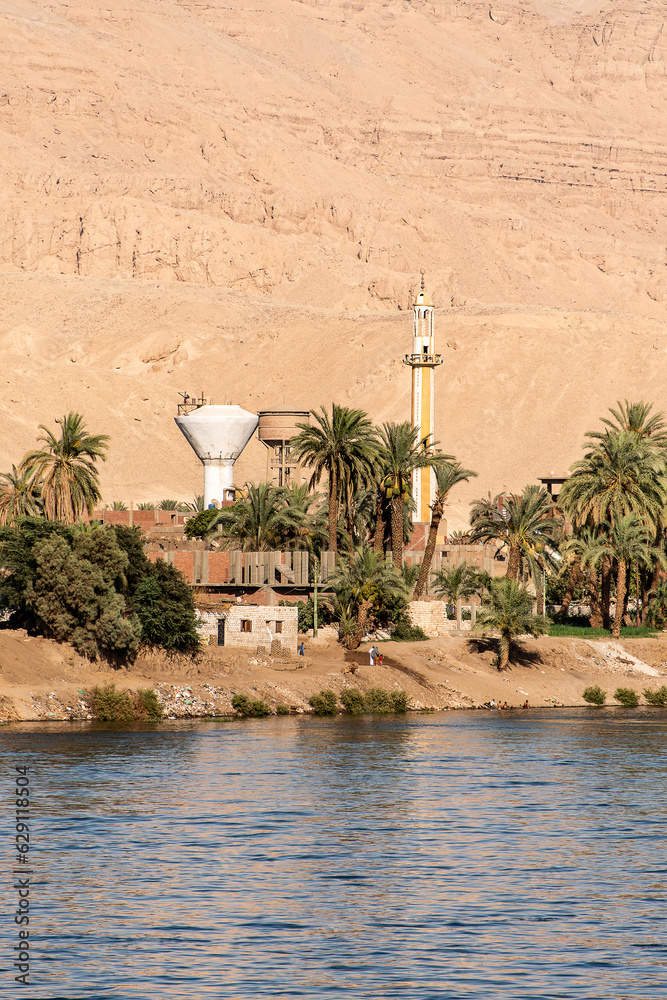 Naklejka premium Panoramic view of fertile banks of Nile and everyday life during river cruise River near Luxor Egypt direction assuan