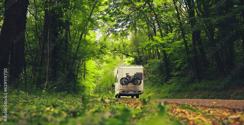 motor home in the forest- travel, vacation,adventure concept