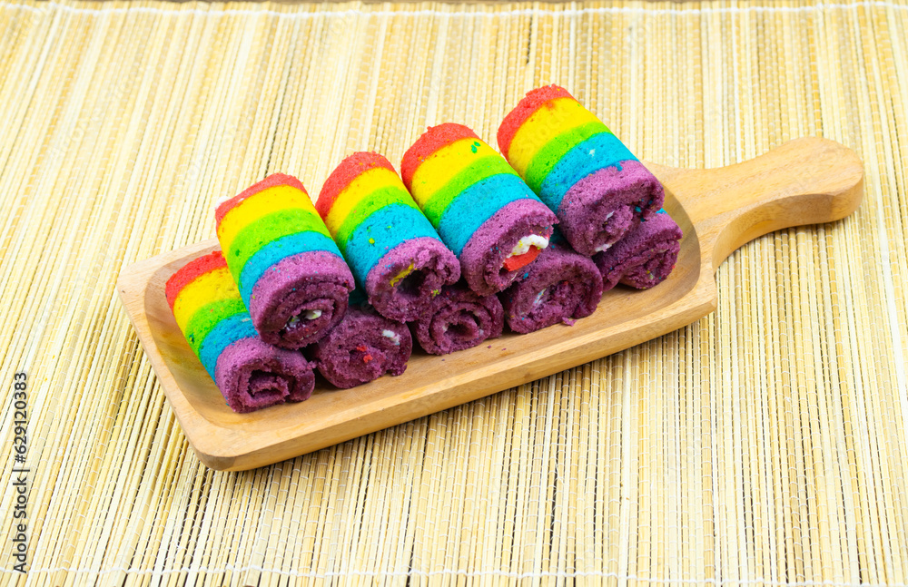 Bolu Kukus (Rainbow Cake) is a layered sponge cake with a blend of seven rainbow colors covered with butter cream. Bolu Kukus (Rainbow Cake) is a layered sponge cake with a blend of seven rainbow colors covered with butter cream.