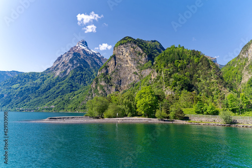 Scenic view of mountain panorama with Lake Lucerne in the foreground on a sunny spring day. Photo taken May 22nd, 2023, Canton Uri, Switzerland. © Michael Derrer Fuchs