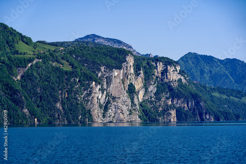 Scenic view of mountain panorama with Lake Lucerne in the foreground on a sunny spring day. Photo taken May 22nd, 2023, Canton Uri, Switzerland. © Michael Derrer Fuchs