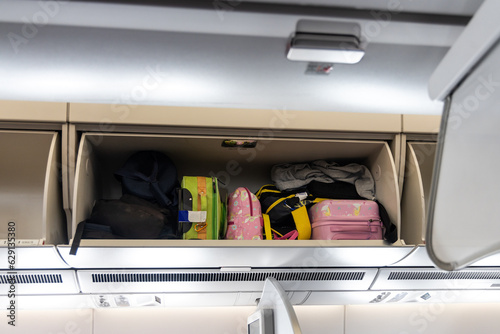 Overhead storage for bags and luggages on airplane cabin