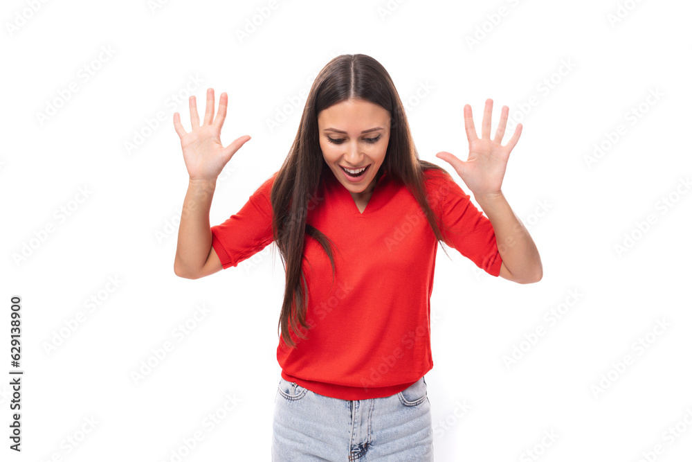 young excited brunette lady dressed in a red t-shirt on a white background young excited brunette lady dressed in a red t-shirt on a white background