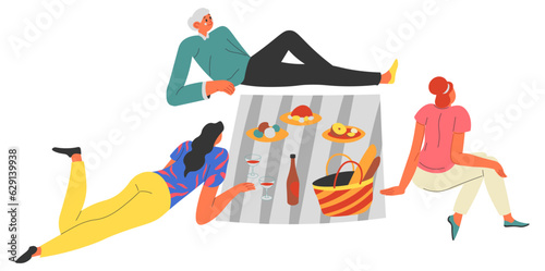People having picnic outdoors, friends eating out
