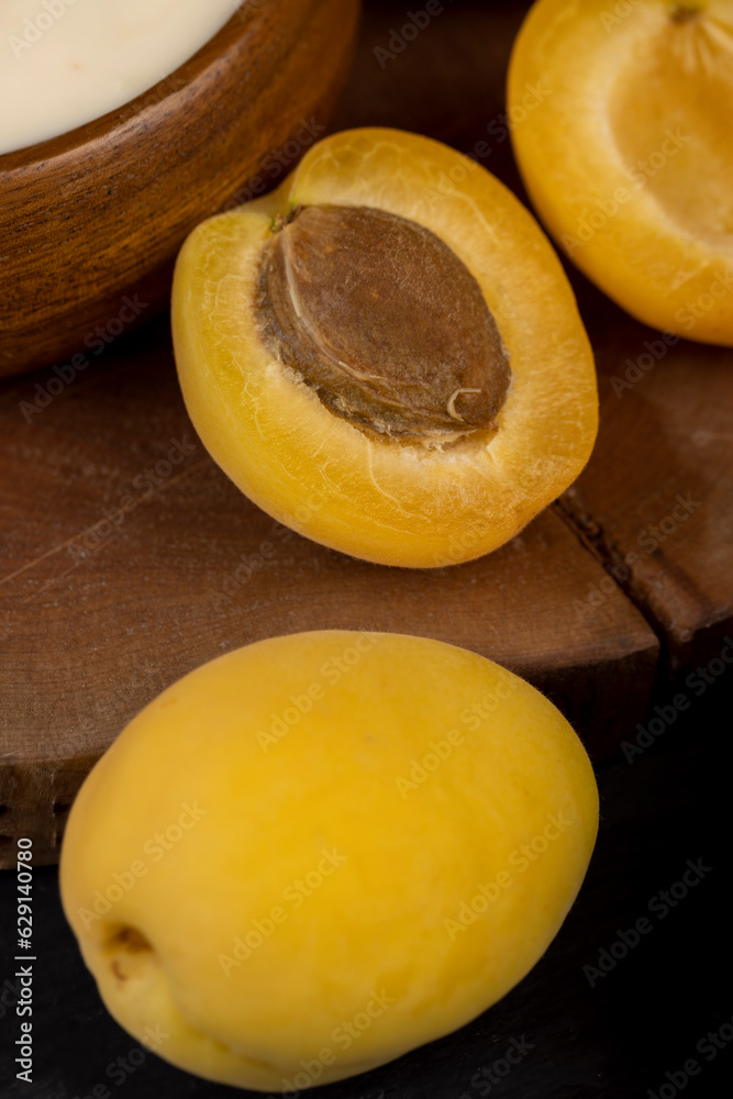 ripe yellow apricots on the table close-up