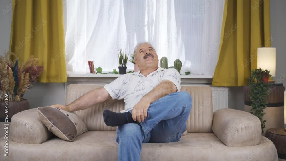Old man lying on the sofa is resting. Old man lying on the sofa is resting.