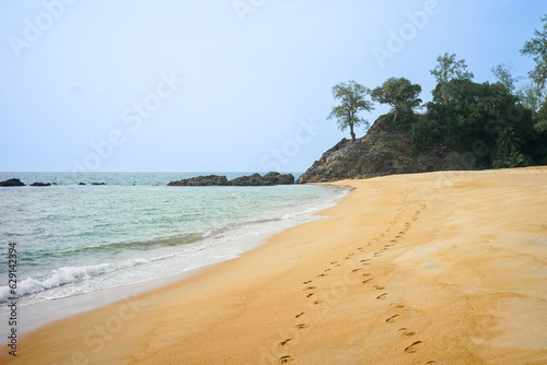 Footprint on the sand with a clear sky on the beach