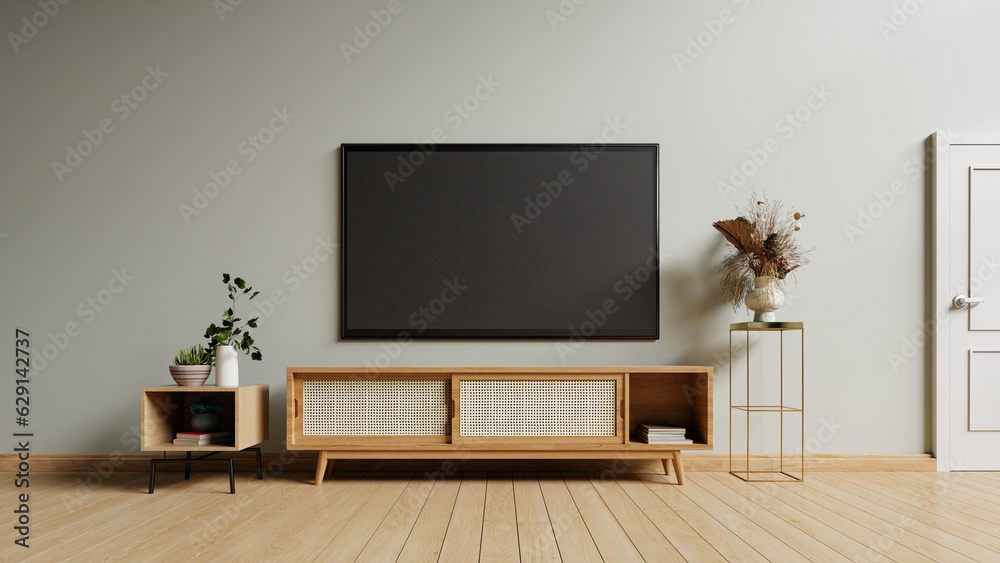 TV on the cabinet in modern living room on gray wall background. TV on the cabinet in modern living room on gray wall background.