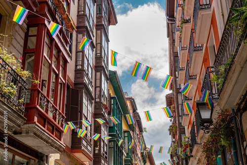 Beautiful streets of European city Bilbao. Situated in North of Span is the largest city in Basque Country and important travel destination. View of historic center. Street decorated with LGBT flag