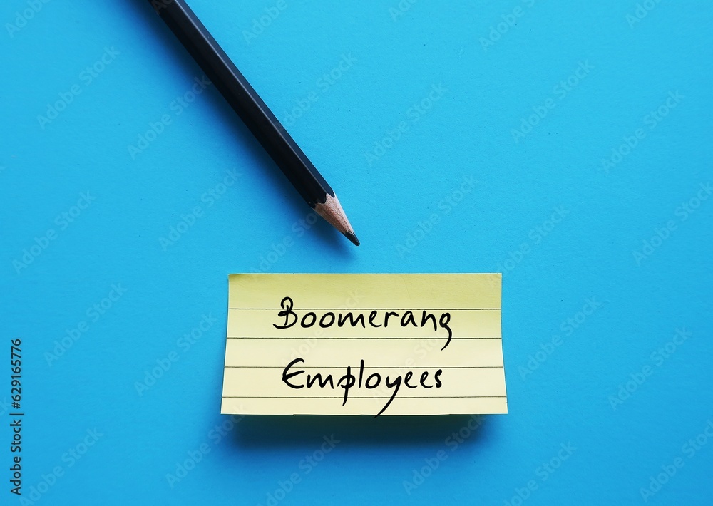 Pencil wrote on yellow note on blue background - Boomerang Employees - workers returning to a former employer as a rehired employee after leaving company for any reasons Pencil wrote on yellow note on blue background - Boomerang Employees - workers returning to a former employer as a rehired employee after leaving company for any reasons