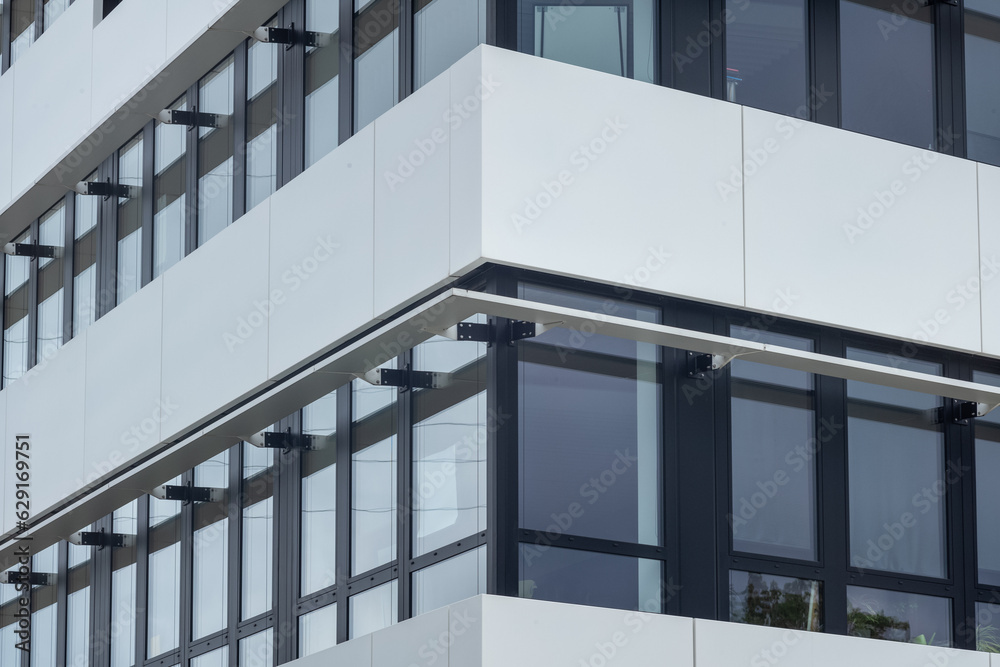facade of a white modern office building facade of a white modern office building