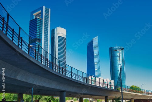 Elevated road with the skyscrapers of the Cuatro Torres Business area in Madrid in the background photo