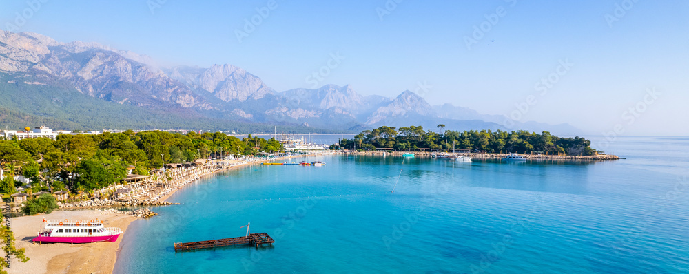 Fototapeta premium Kemer, Antalya, Turkey. Aerial view of Moonlight Beach in Kemer. Beautiful turquoise colors of Mediterranean sea. Drone shot.