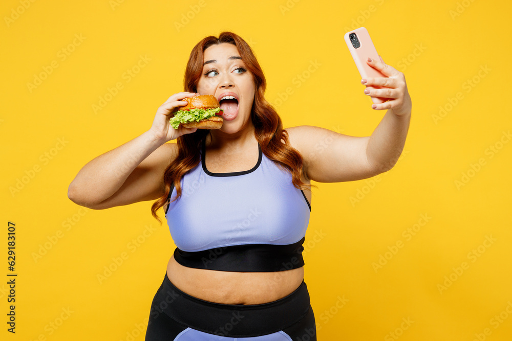Young chubby overweight plus size big fat fit woman in blue top warm up