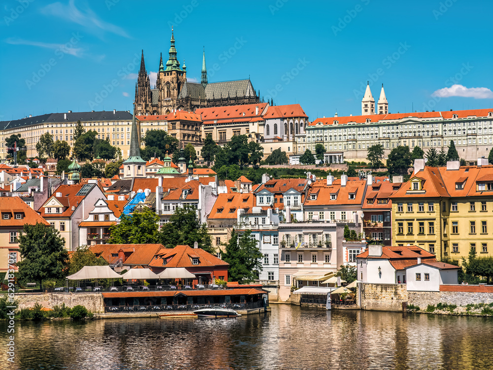Old colorful houses and St. Vitus Cathedral in Prague.