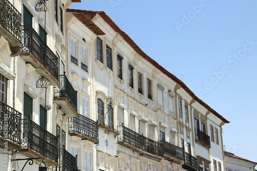 Facades of typical buildings at the main square of the city: Praça do Giraldo, Évora, Alentejo, Portugal