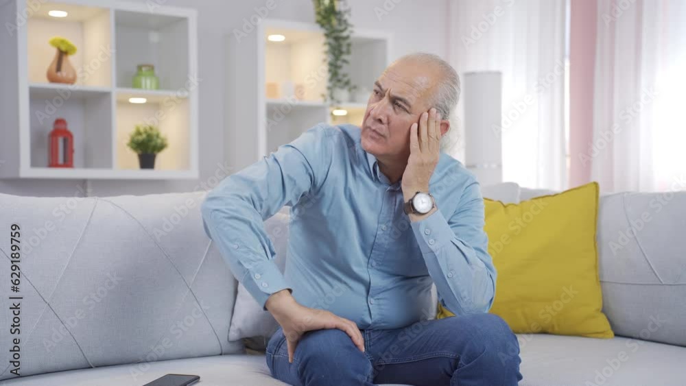 Unhappy thinking old man. Unhappy thinking old man.
