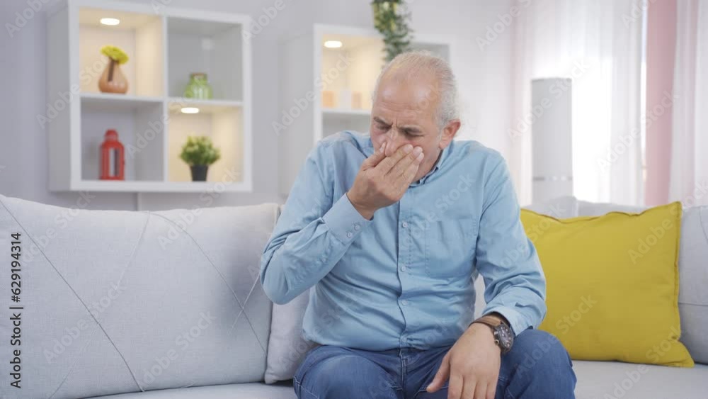 The old man who smells bad odor is disturbed and disgusted. The old man who smells bad odor is disturbed and disgusted.