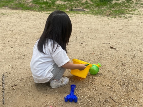 child playing with sand