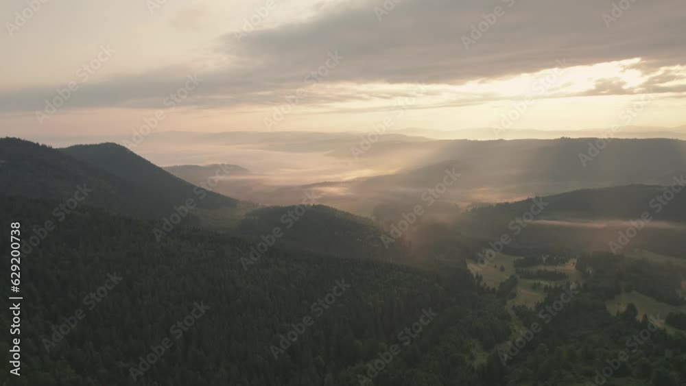 Aerial sunrise scene over foggy valley Aerial sunrise scene over foggy valley