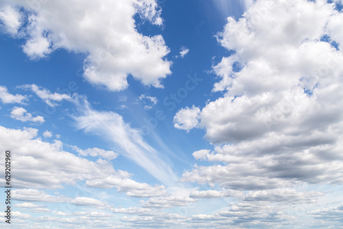 Canvas Print Beautiful epic soft gentle blue sky with white cirrus and fluffy cloud in sunlig