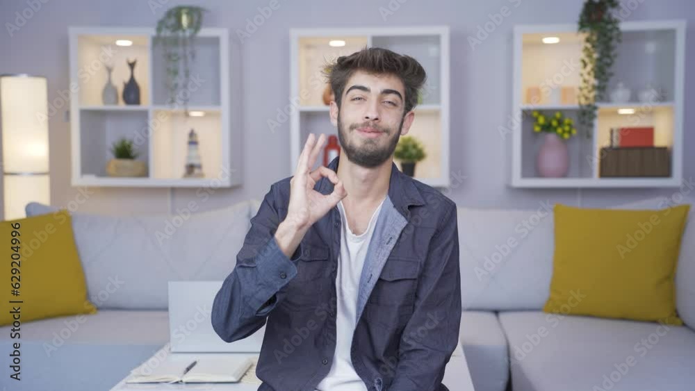 Man making positive gesture at camera. Man making positive gesture at camera.
