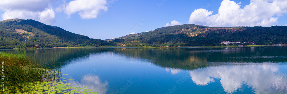 View of Abant Lake (Abant Golu). Landscape of an mountain lake in front of mountain range. Glorious lake landscape. The collaboration of blue and green. Multiple colors and amazing lake scenery.