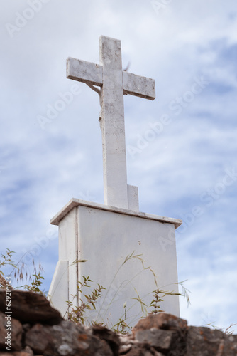 a cross in a stone church cemetery