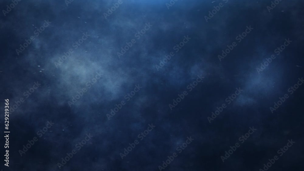 Blue Atmosphere Clouds and Particles 4K Loop features blue clouds and particles flowing off screen in a black atmosphere in a loop.