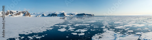 Drone shot of a ship in a bay in Svalbard photo