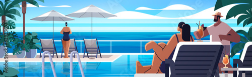 people relaxing at tropical luxury resort hotel beach swimming pool and poolside seating area summer vacation concept