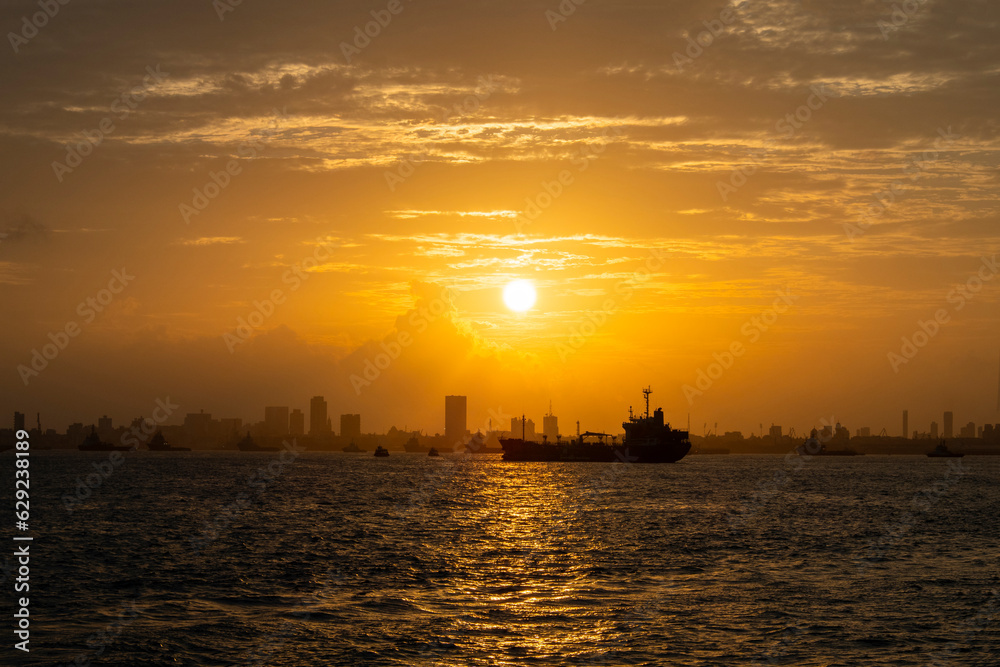 Cityscape and amazing summer sunset over the Arabian sea in Mumbai, Bombay in India.